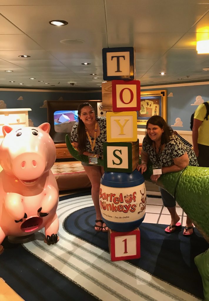2 ladies with Toy Story Blocks Ham the Pig and Rex