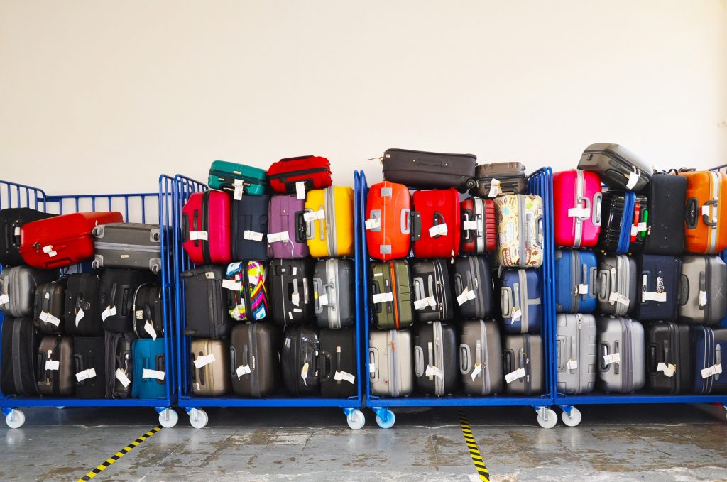 Luggage racks with many colorful suitcases